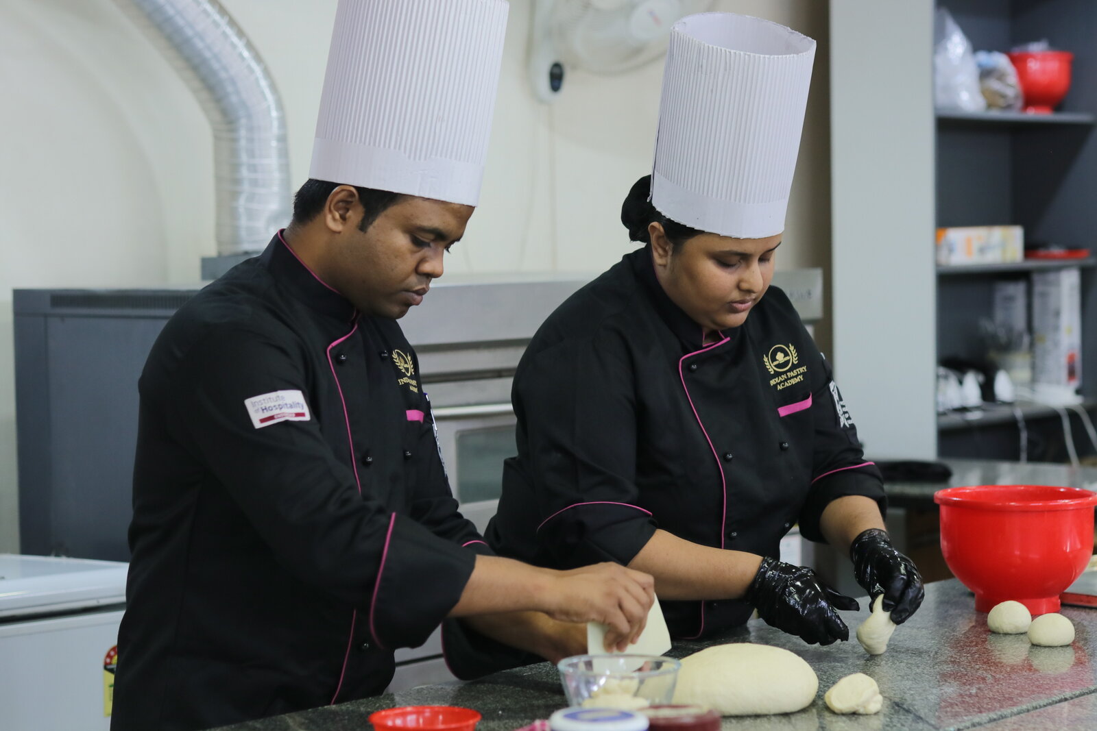 Chef instructor and student training in dough handling at Indian Pastry Academy in Bangalore